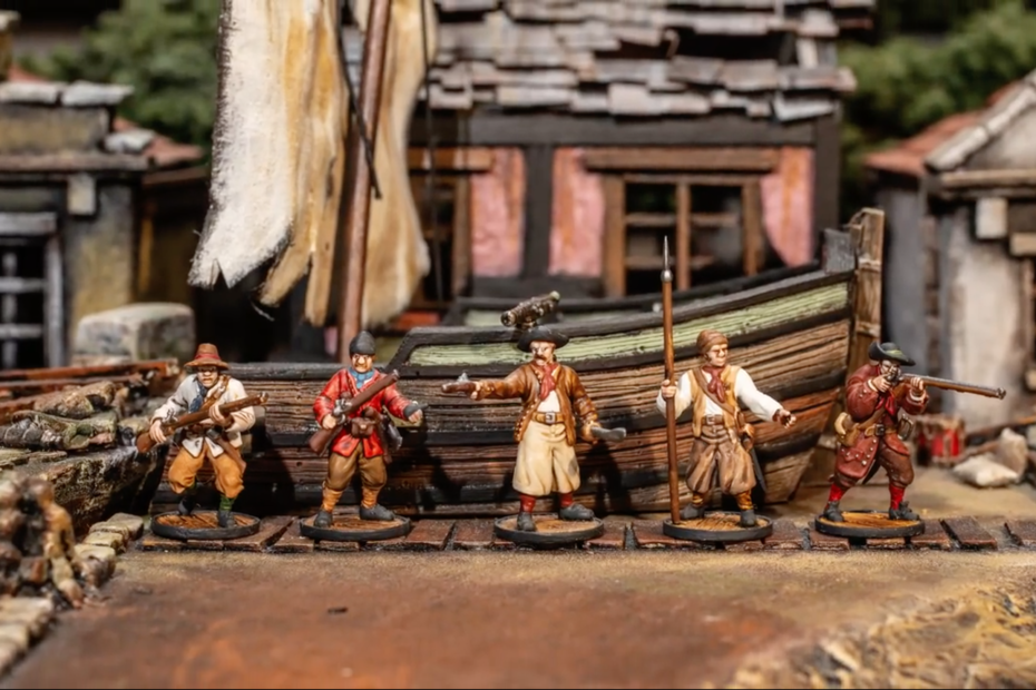French Buccaneers Faction of miniatures in front of a ship that has run aground and some ruined houses